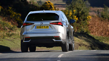 Lexus NX 300h driving - rear