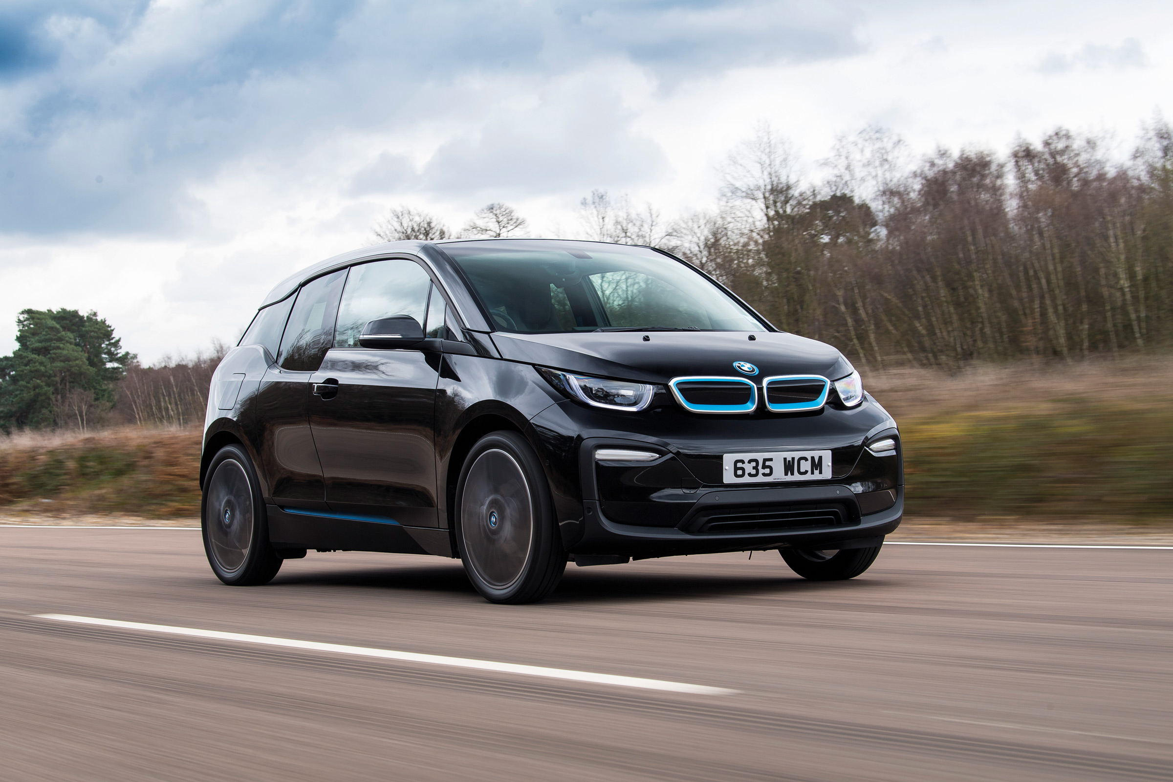 BMW i3 driving along road