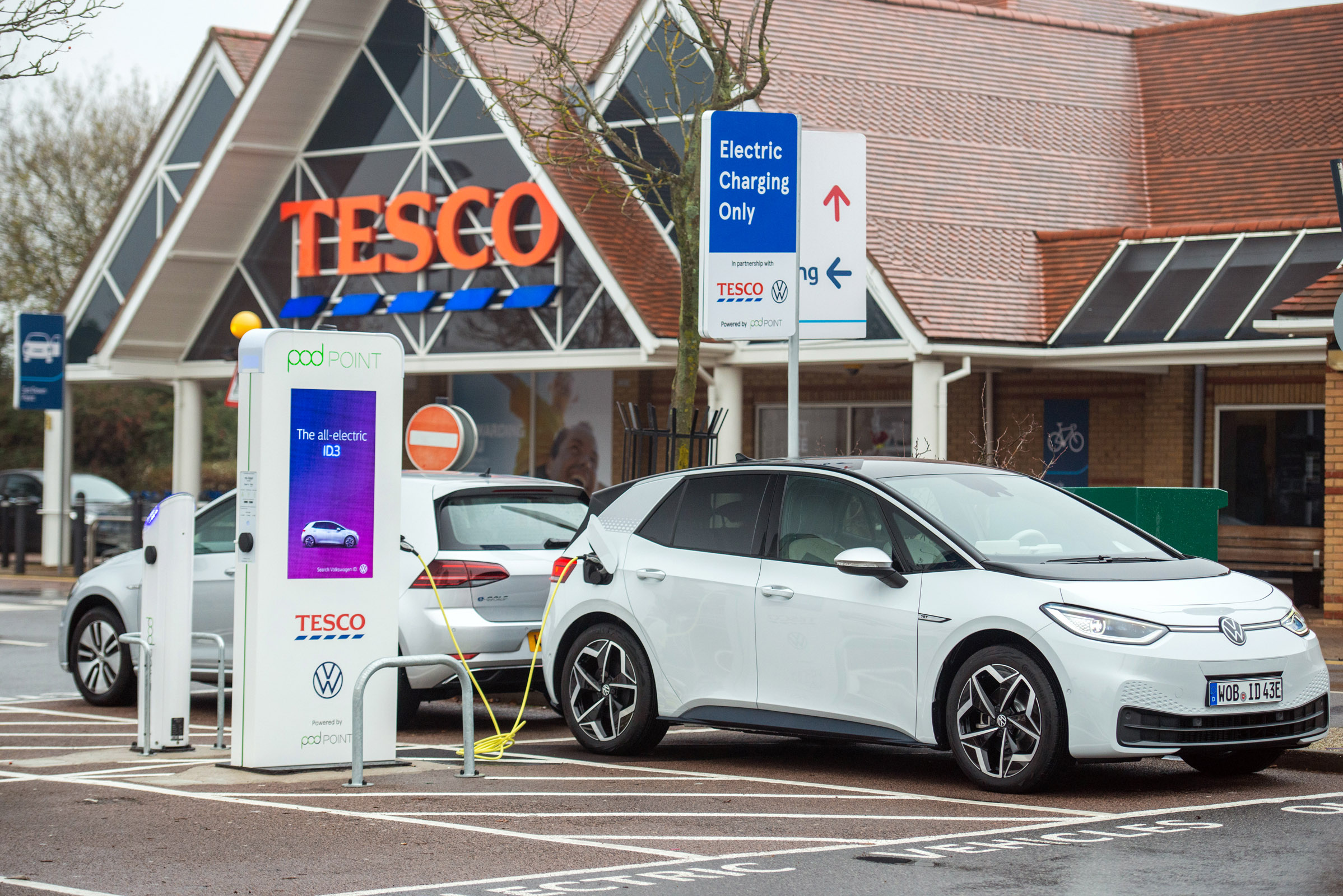Electric VW ID3 car charging outside of Tesco, Potters bar, 24th November 2019