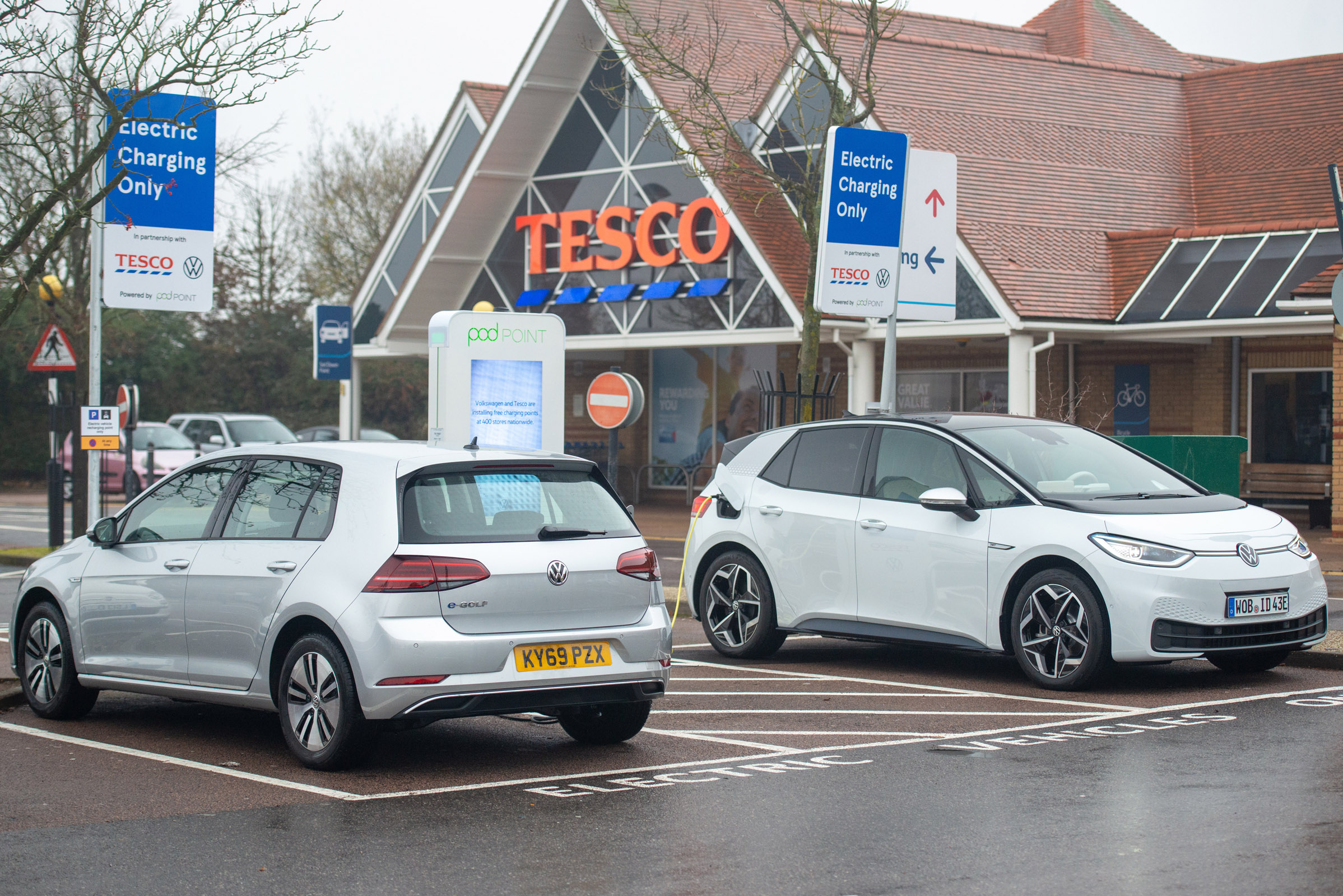 Electric VW ID3 car charging outside of Tesco, Potters bar, 24th November 2019