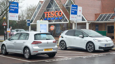 Electric VW ID3 car charging outside of Tesco, Potters bar, 24th November 2019