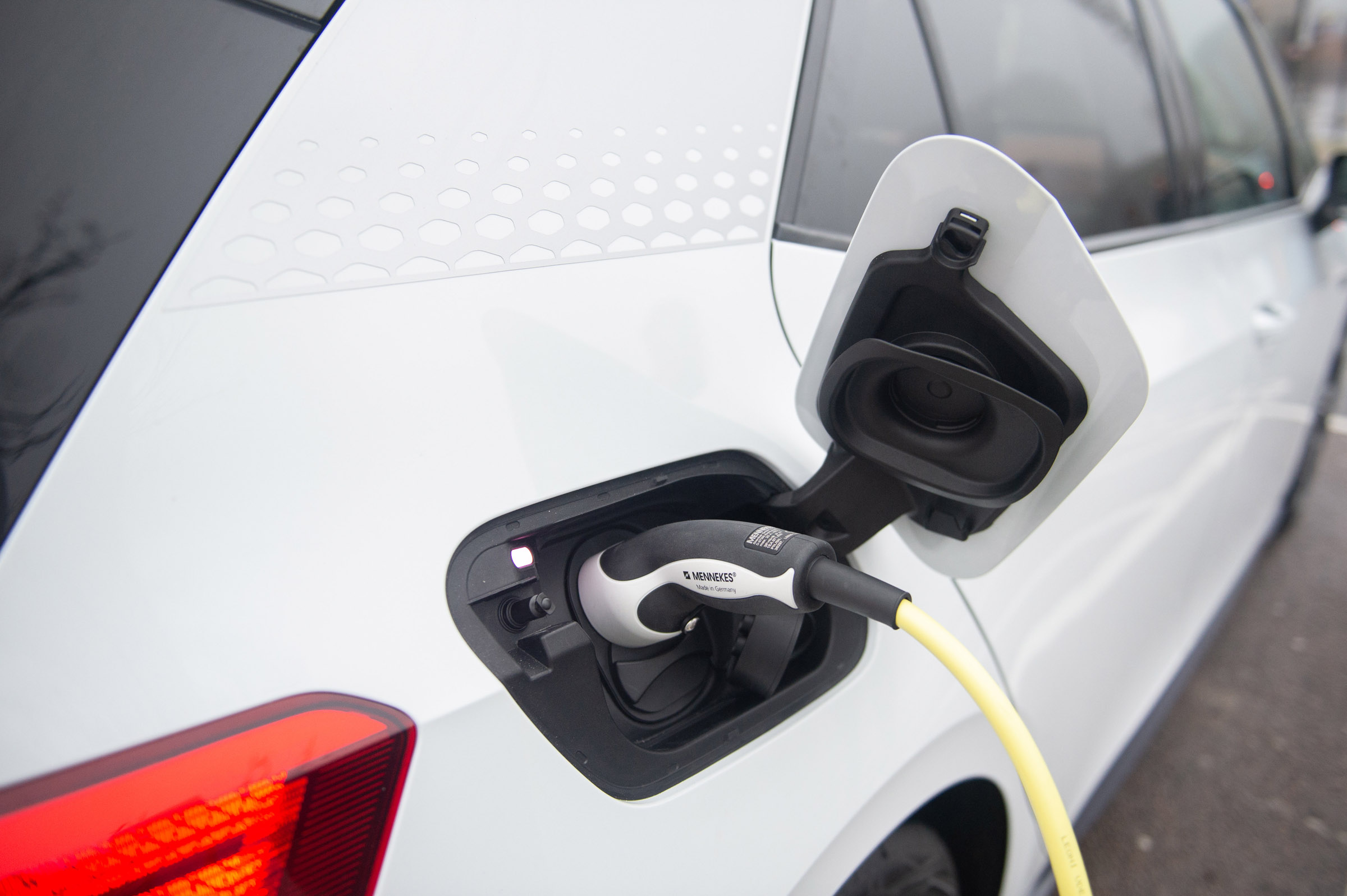 Electric VW ID3 car charging outside of Tesco, Potters bar, 24th November 2019