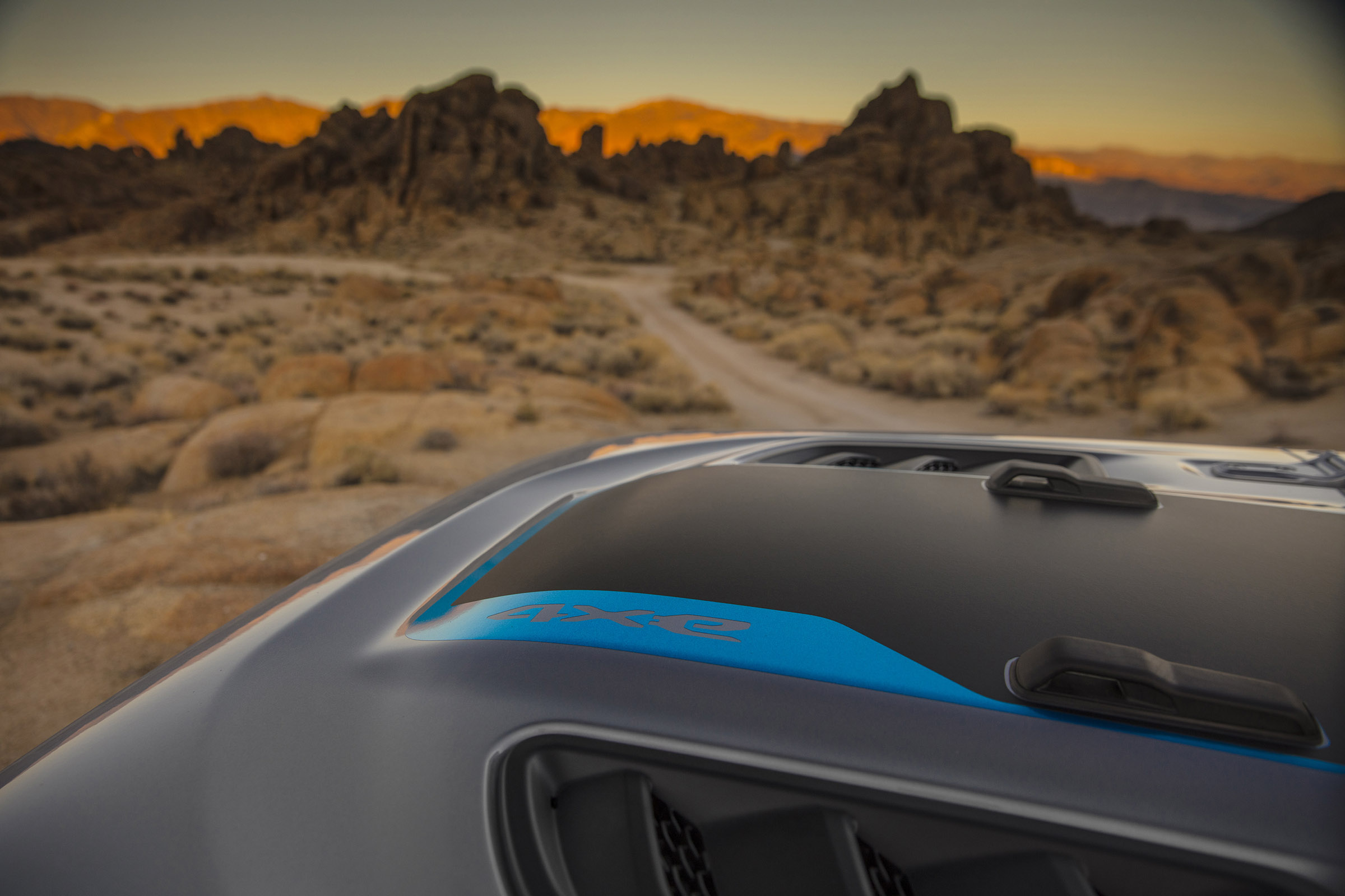 The hood graphic on the 2021 Jeep® Wrangler Rubicon 4xe includes a Surf Blue accent.