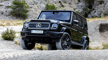 Mercedes G 580 driving over rocky terrain