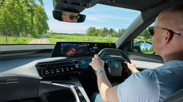 Auto Express chief reviewer Alex Ingram driving the Peugeot E-3008