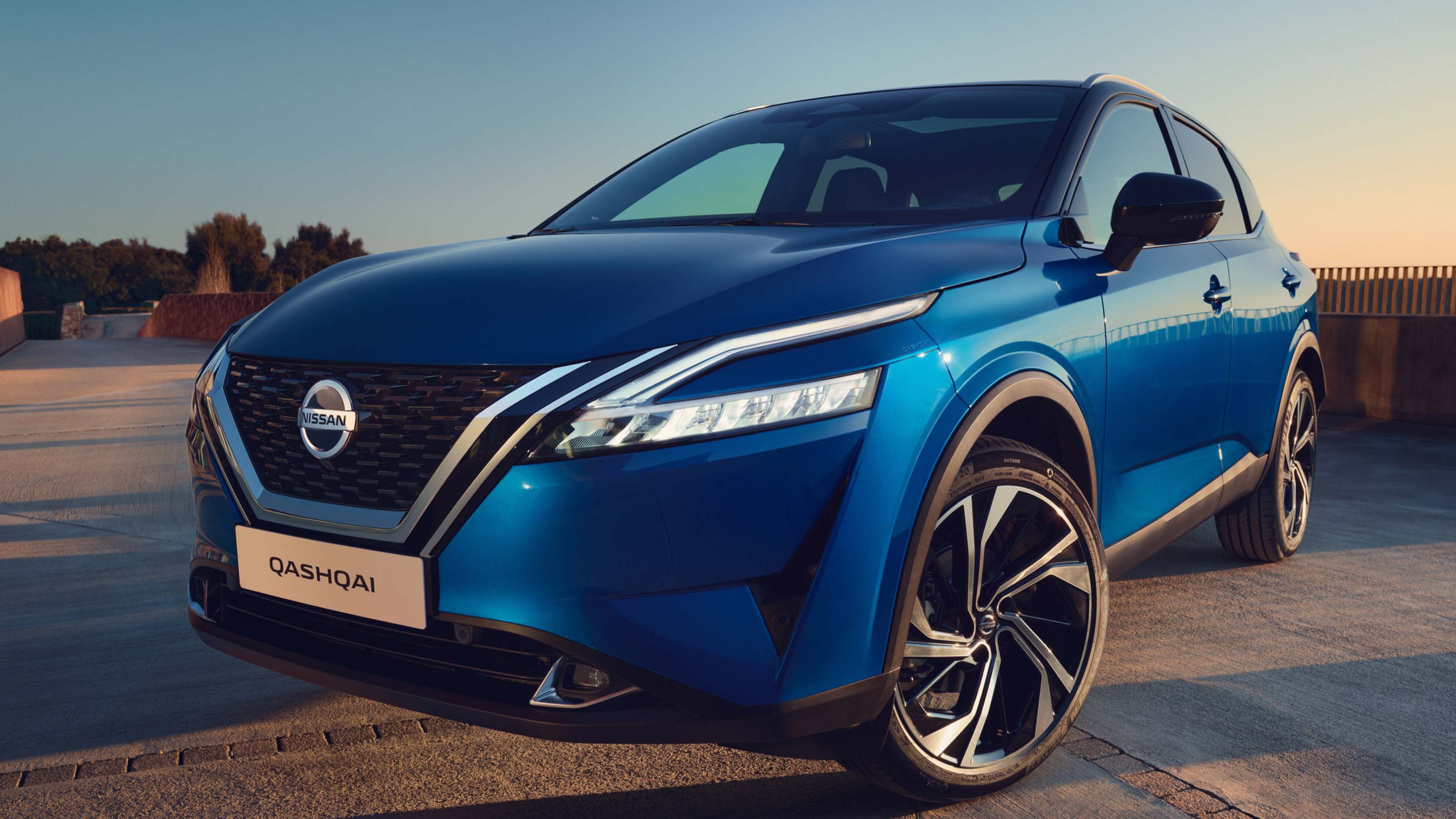 Blue Nissan Qashqai parked